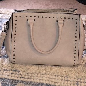 Violet ray studded purse